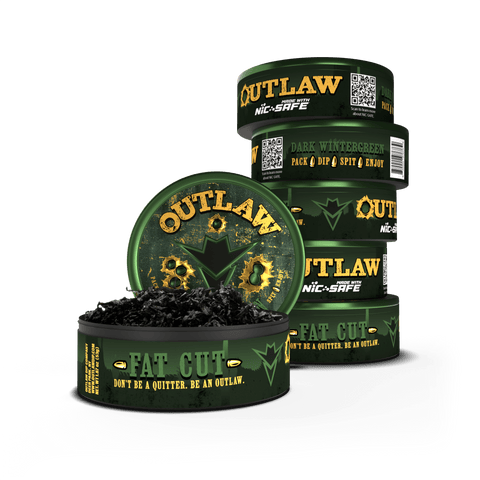 Stack of six Outlaw Dark Wintergreen fat cut cans with one container open showing the long cut product inside. The packaging is primarily in dark green with text and branding showing it's tobacco and nicotine free.
