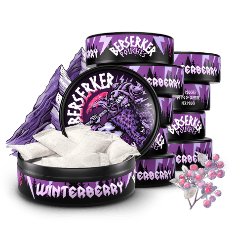 10 Purple and black containers of Berserker Caffeine Pouches with winterberry flavor on a transparent background with frozen berries in the foreground.