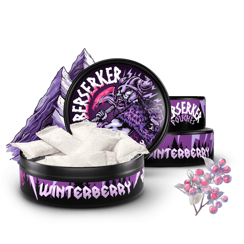 3 Purple and black containers of Berserker Caffeine Pouches with winterberry flavor on a transparent background with frozen berries in the foreground.