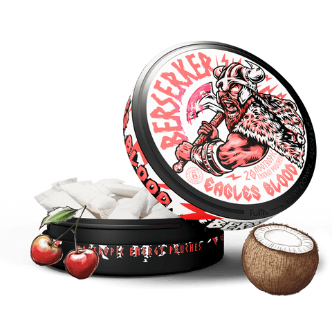 A product image featuring a tin container with the label 'Berserker Eagles Blood' and an illustration of a Viking. The container is accompanied by a coconut and apples, suggesting the flavor of the caffeinated pouches inside.