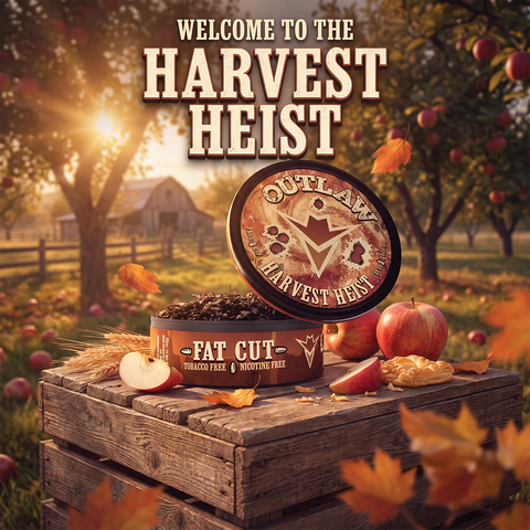 A round tin of Outlaw Fat Cut Straight Free Moisture Free beef jerky is displayed on a wooden crate in an autumn apple orchard setting. The lid of the tin is propped up, showing the brand logo and 'OUTLAW' text.