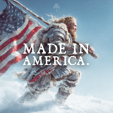 Person in warrior costume holding an American flag with 'MADE IN AMERICA' text