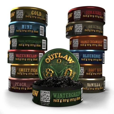 A collection of Outlaw branded chewing tobacco free cans in various flavors, including Wintergreen, Blueberry, Peach, Vanilla, and Watermelon, with an open can of Wintergreen dip in the center showing the long cut chew product inside.