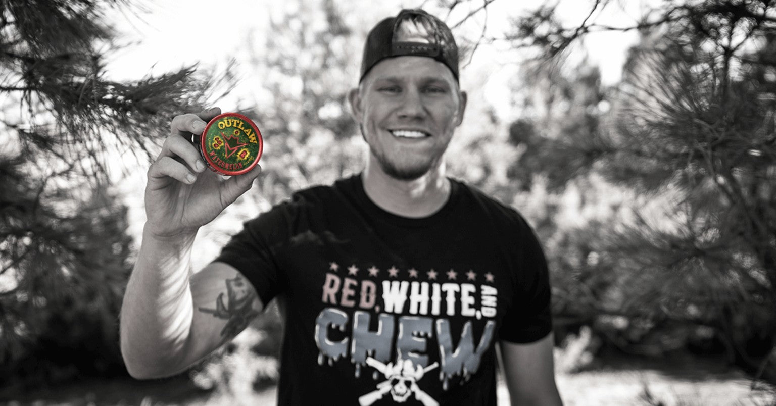 Jared Outlaw, founder, holding an Outlaw Watermelon can outdoors